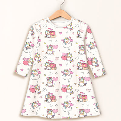Girls unicorn birthday long sleeve dress in white with cartoon unicorns hearts and stars in pink and rainbow colors