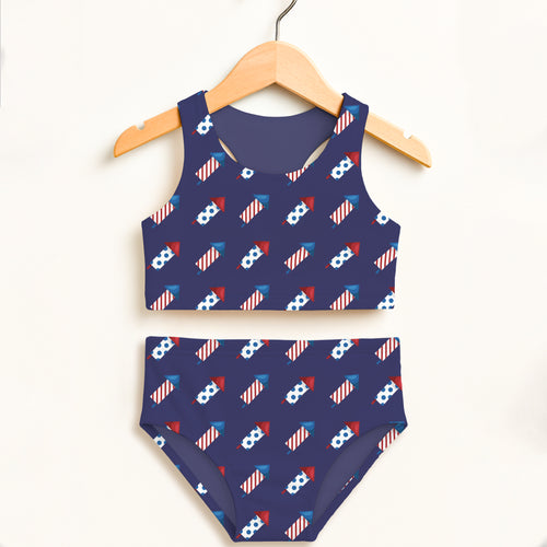 Girls fireworks rockets navy blue two-piece swimsuit with playful rocket and flag pattern double layered upf 50 high waisted