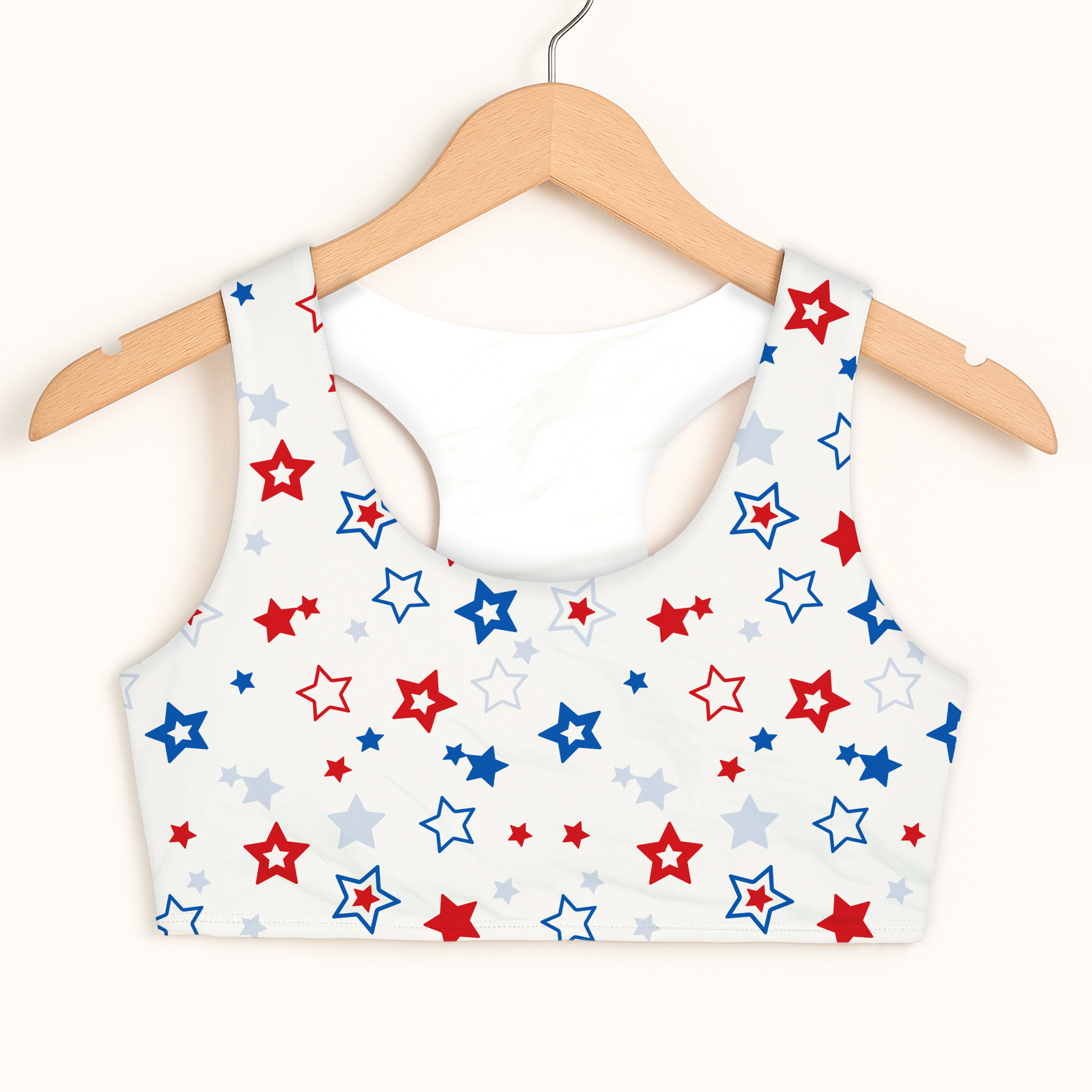 Girls red white and blue stars sports bra with quick drying fabric and double layered comfort in white with star pattern